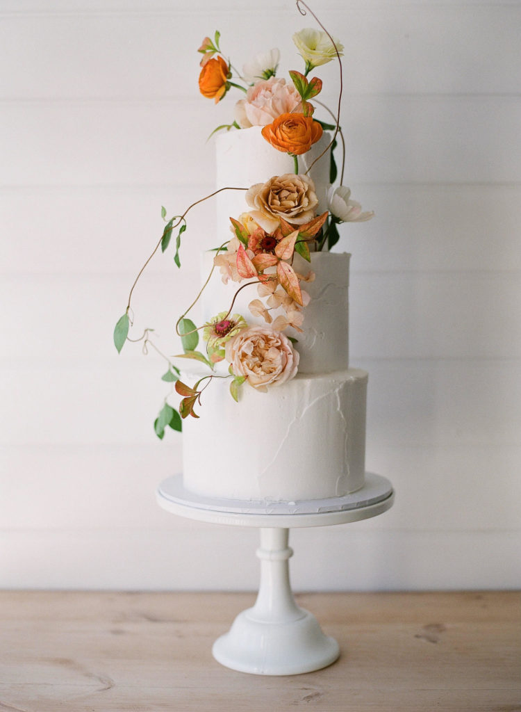 3 tier wedding cake with summer floral decoration