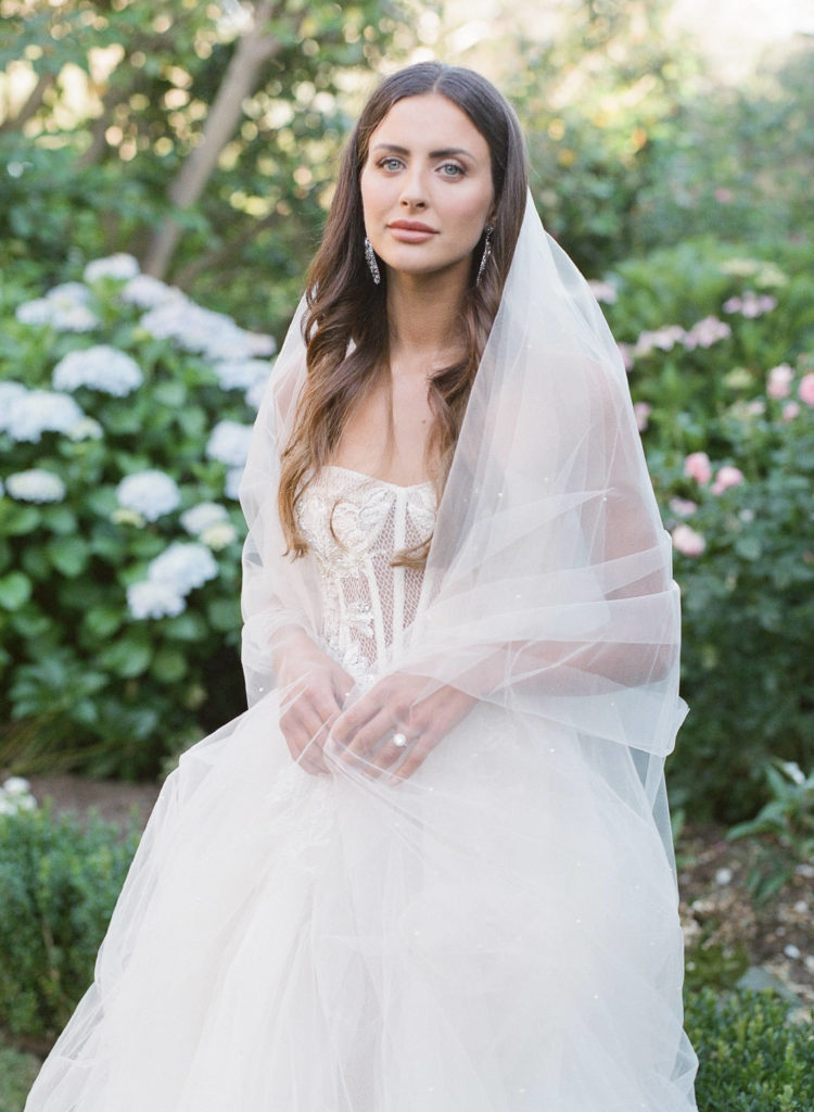 beautiful bride surrounded by greenery