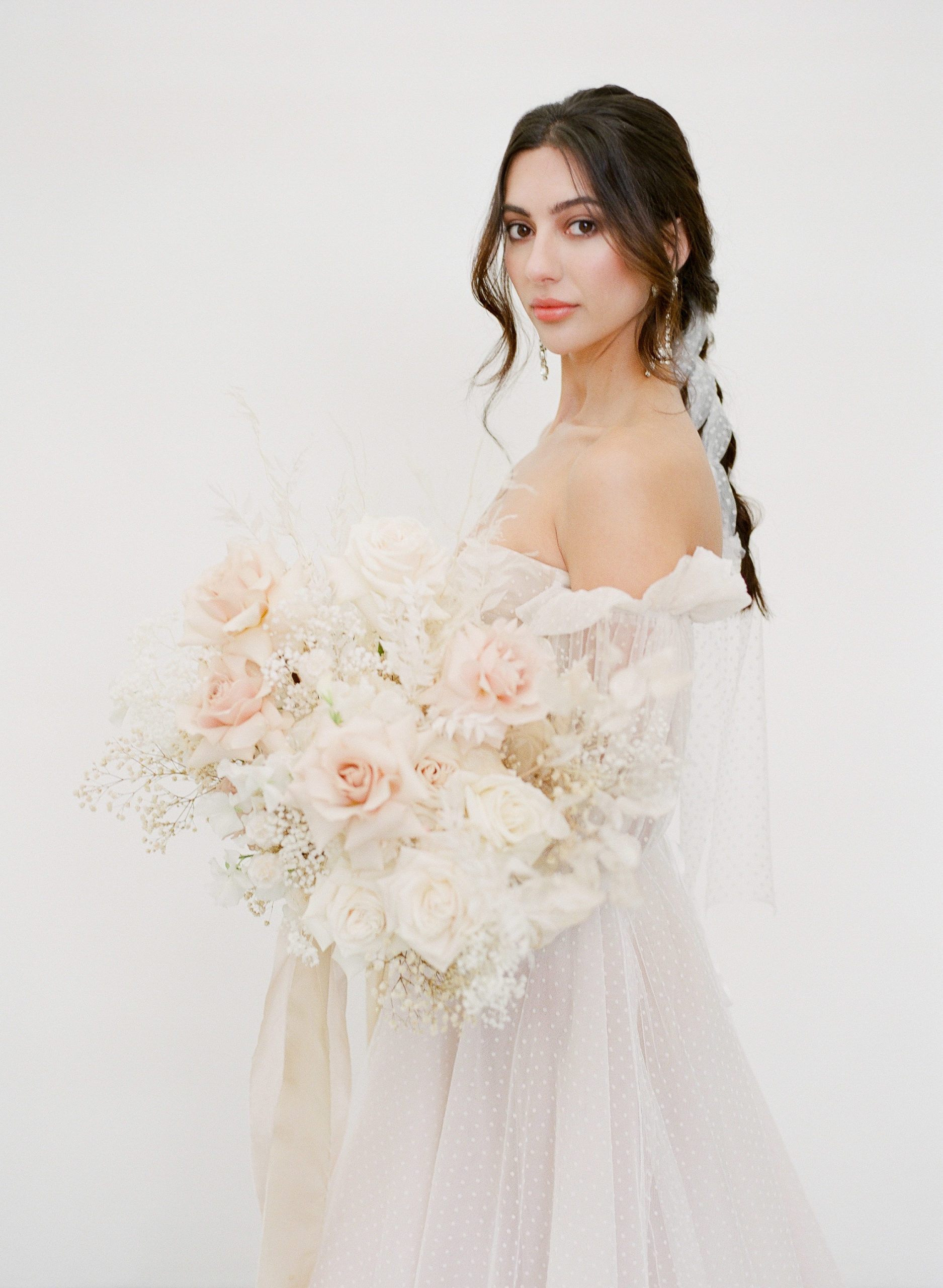 bride holding a luscious bouquet